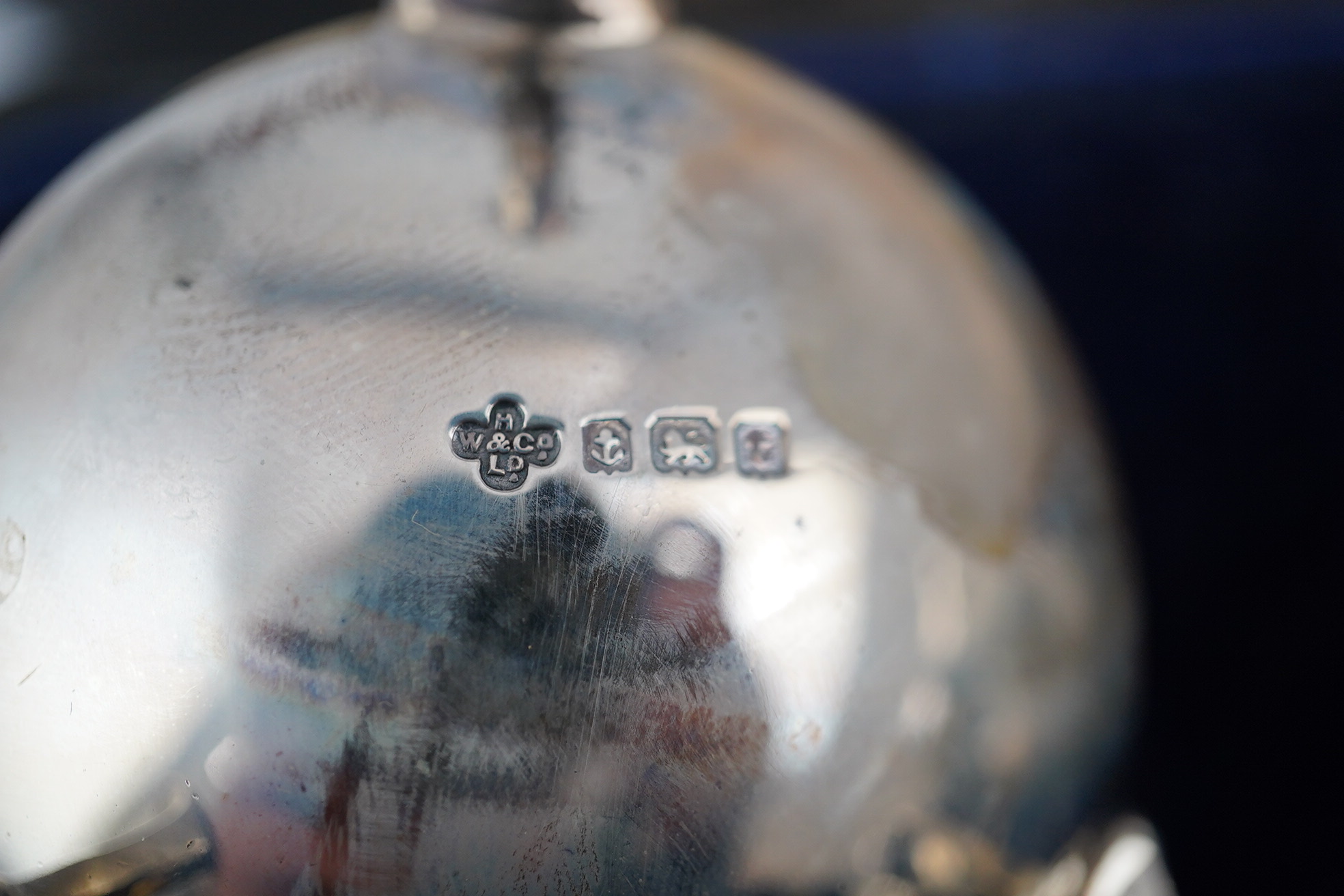 A George V cased silver seven piece condiment set by Horace Woodward & Co Ltd, Birmingham, 1918, with five associated silver condiment spoons. Condition - poor to fair